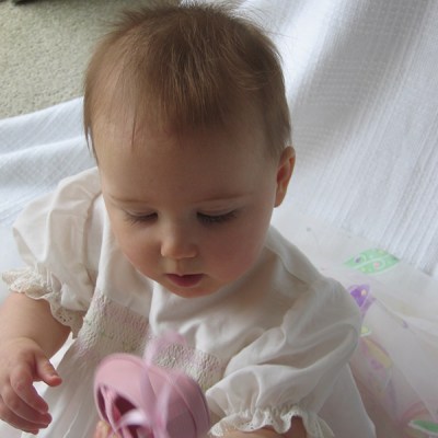 Baby girl with pink ballet shoe